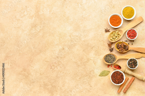 Set with aromatic spices on beige background photo