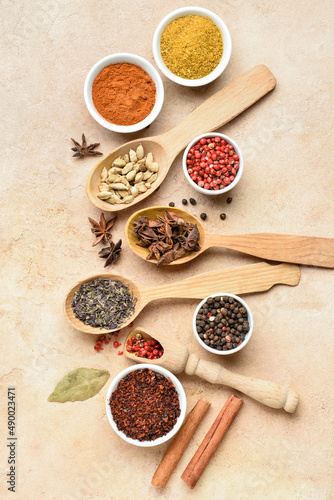Fototapeta Naklejka Na Ścianę i Meble -  Set with aromatic spices on beige background