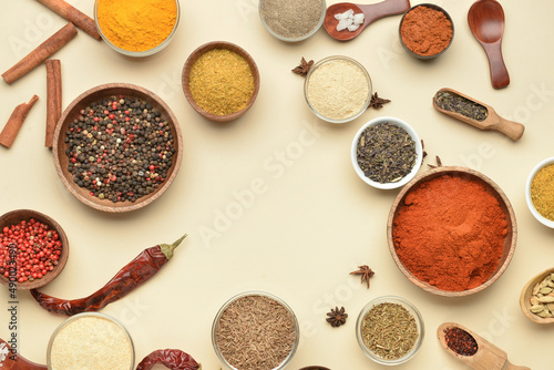 Fototapeta Naklejka Na Ścianę i Meble -  Bowls with aromatic spices on yellow background