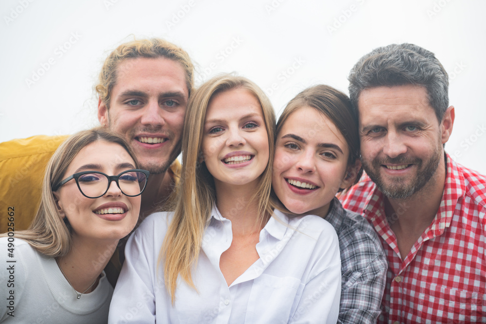 Photo of happy company students best friends making selfies. Group of happy people young friends, close up face.