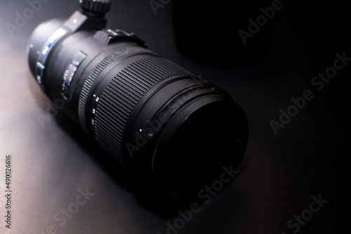 Professional zoom lens for digital cameras isolated on a black background