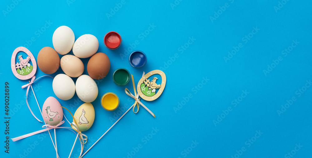 Template for easter holiday with eggs and paints and copy space Template for easter holiday with eggs and paints and copy space