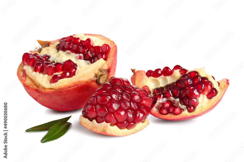 Tasty pomegranate pieces on white background Tasty pomegranate pieces on white background
