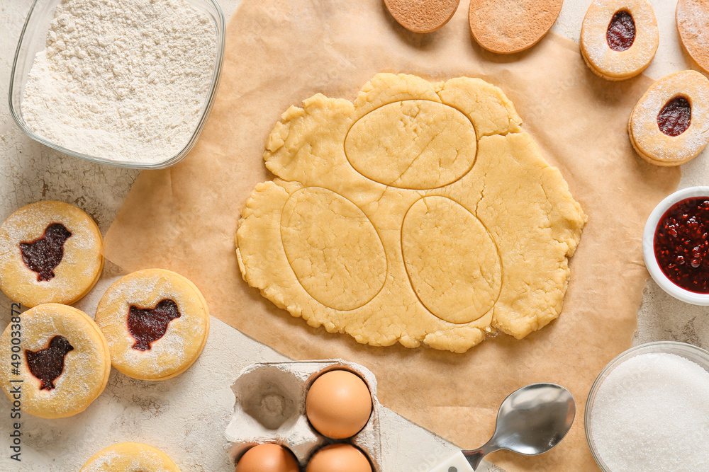 Fresh dough and ingredients for preparing cookies for Easter celebration on table Fresh dough and ingredients for preparing cookies for Easter celebration on table