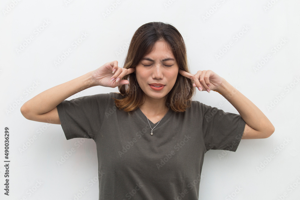 Asian Woman covering her ears on white background
Asian Woman covering her ears on white background