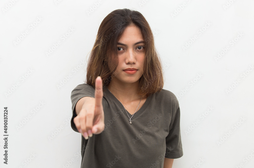 Asian woman with stop gesture with her hand
Asian woman with stop gesture with her hand