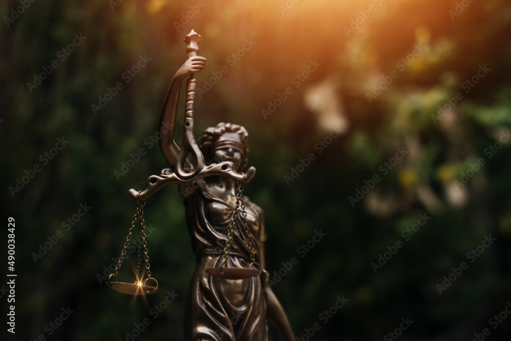 Judge gavel with Justice lawyers having team meeting at law firm in background. Concepts of law.