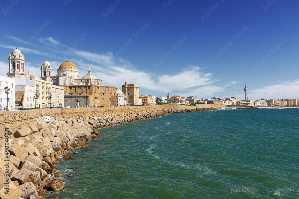 The Atlantic coast in Cadiz with the Santa Cruz Cathedral and the San Roque stronhold