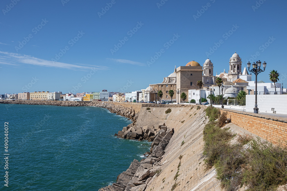 The sea shore of Cadiz with the Santa Cruz Cathedral