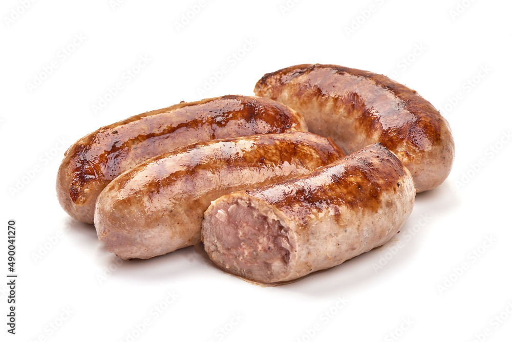 Fototapeta premium Grilled Munich sausages with green lettuce, isolated on white background.