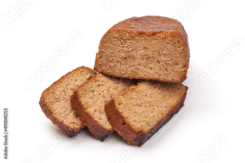 Baked meatloaf with boiled eggs, isolated on white background.
