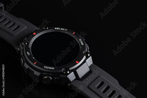 Smart watch concept on black background, display turned off