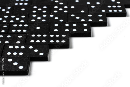 Black dominoes on a white background  top view. Board game. Place for text