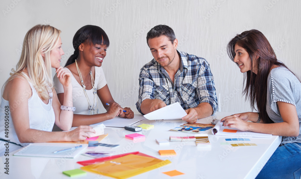 Brainstorming session at an agency. A creative team brainstorming in the boardroom together. Brainstorming session at an agency. A creative team brainstorming in the boardroom together.