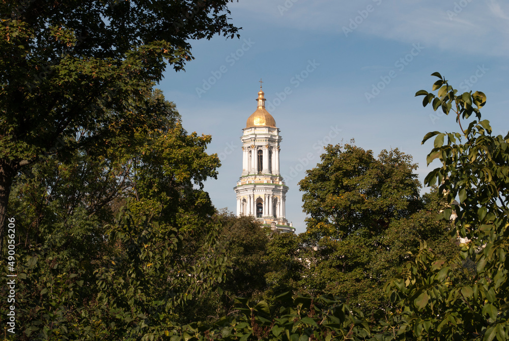 Bell tower in the green forest. Kiev-Pechersk Lavra. Kyiv. Ukraine 