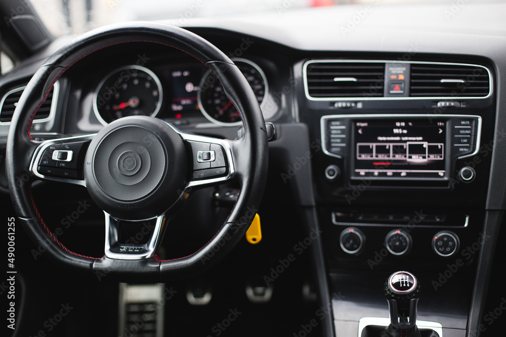 Car interior luxury steering wheel. Dashboard, climate control, display