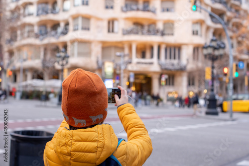 Photography Child, posing in front of Casa Mila in Barcelona