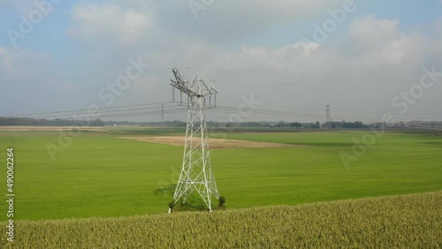 Electricity pylon in green field, Oosterhout, Netherlands photo