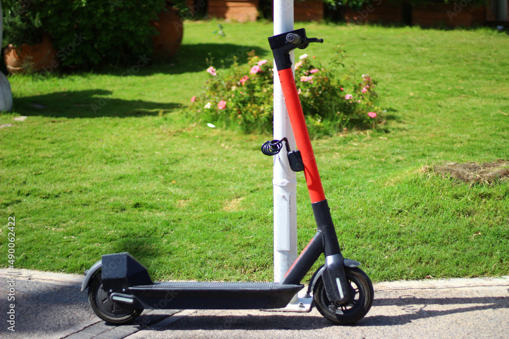  Pole-mounted rental scooter on the street