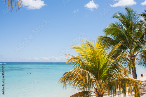 Fototapeta Naklejka Na Ścianę i Meble -  Public beach of Troux aux biches at Mauritius islands, Africa with palms,turquoise water and white sand from luxury hotel