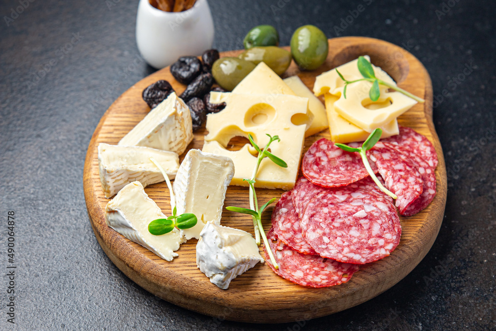 snack plate cheese, sausage, olive, bread stick fresh appetizer meal food snack on the table copy space food background
