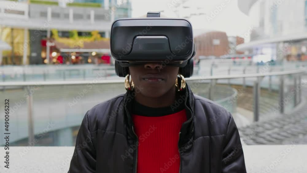 Woman with VR goggles in city, Italy Woman with VR goggles in city, Italy