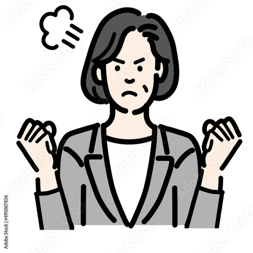 怒っているグレーのスーツを着た中年女性
