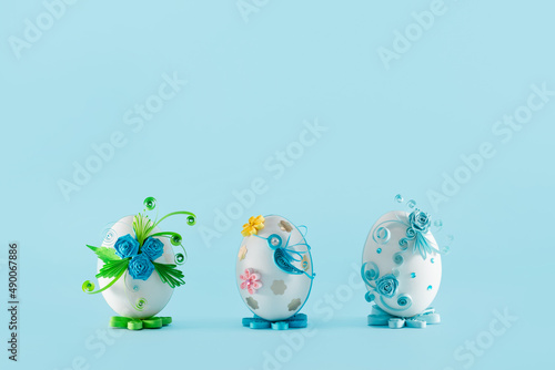Three Easter eggs on a blue background