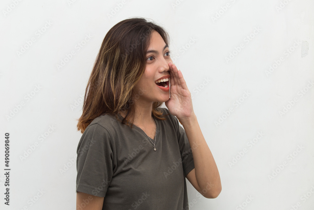 young asian woman shouting and yelling announcing isolated on white background
young asian woman shouting and yelling announcing isolated on white background