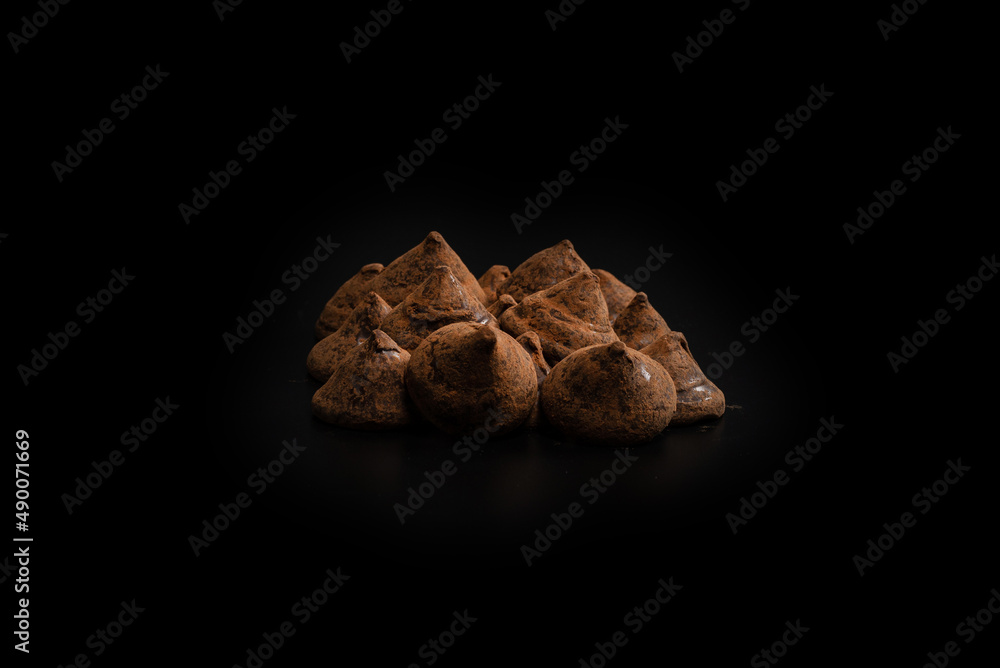 Chocolate truffles on a black background. Chocolate truffles on a black background.