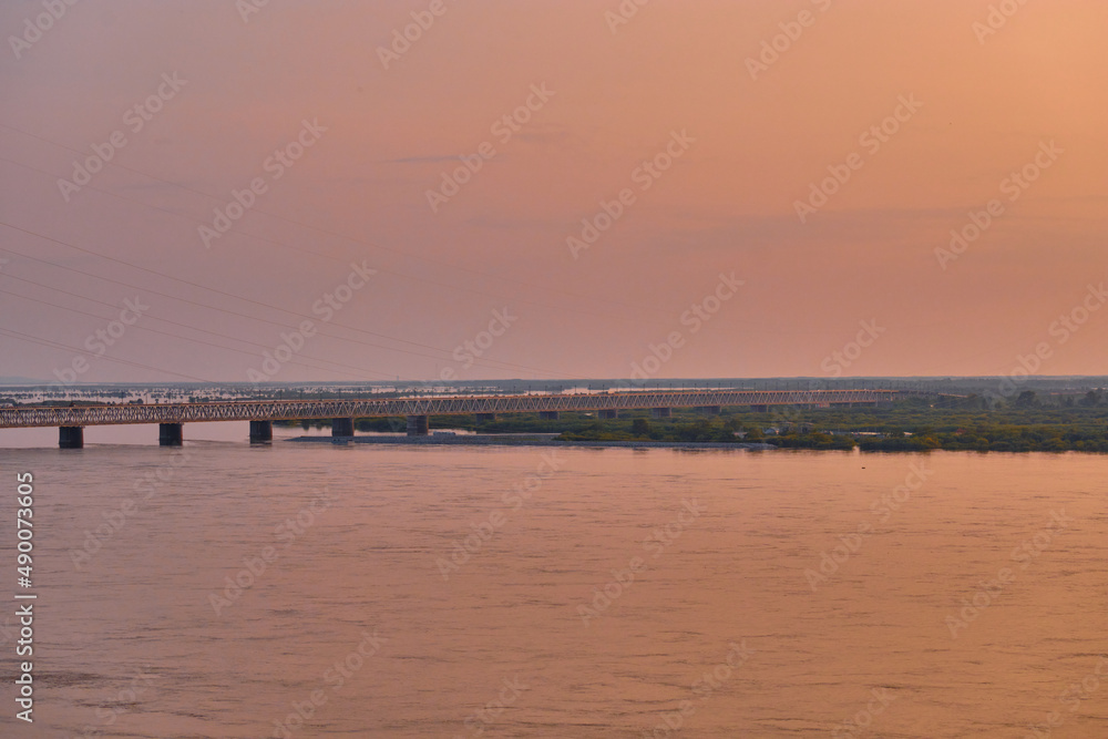 Khabarovsk, Russia - Aug, 14, 2021: Bridge over the Amur River in Khabarovsk, Russia. Evening photography.