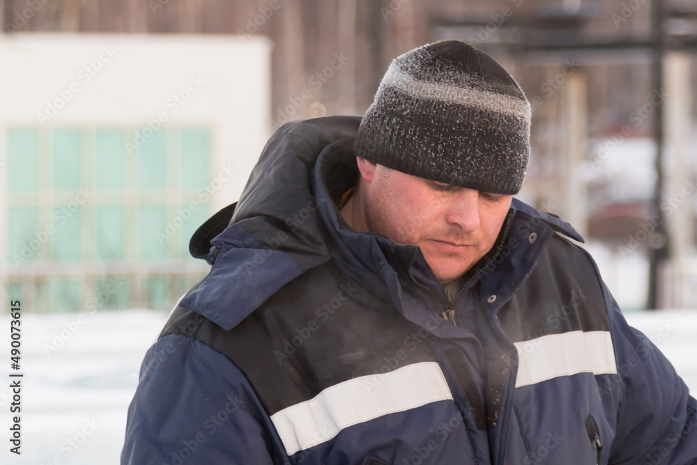 Portrait of an installer at the construction of an ice town Portrait of an installer at the construction of an ice town