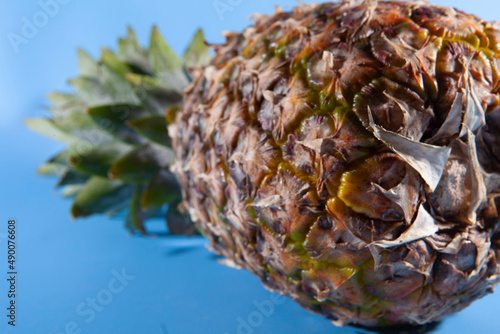 Pineapple on a blue background. close-up view