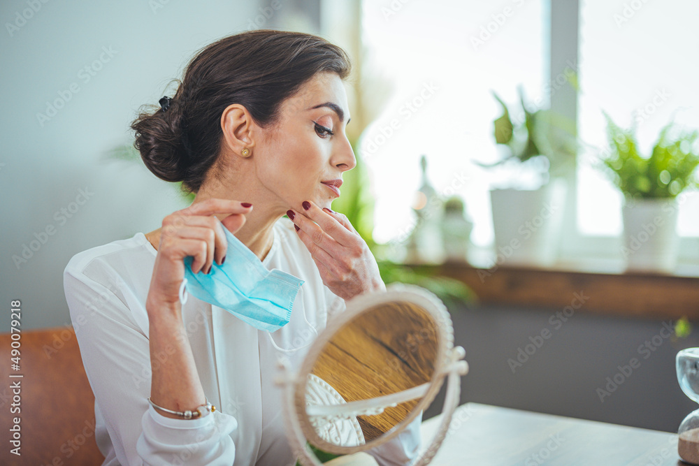 Woman with prevention mask and skin irritation on white background