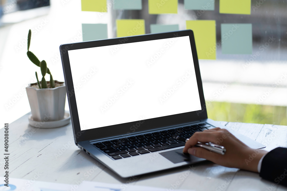 Young man working on his laptop with blank copy space screen for your advertising text message in office, Back view of business man hands busy using laptop at office desk Young man working on his laptop with blank copy space screen for your advertising text message in office, Back view of business man hands busy using laptop at office desk