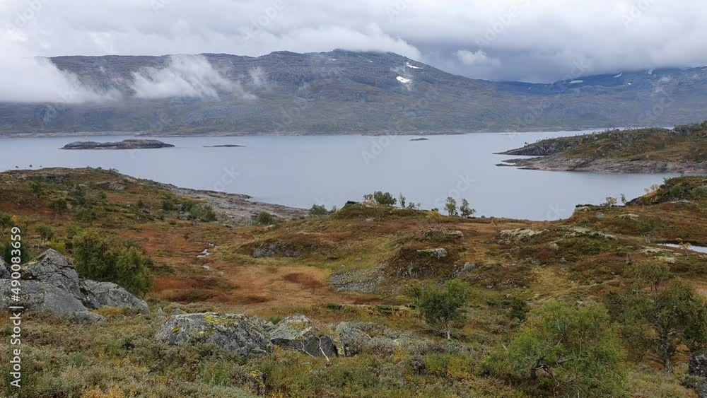 Mountainous landscape in norway. Clouds above a lake on a high plateau Mountainous landscape in norway. Clouds above a lake on a high plateau