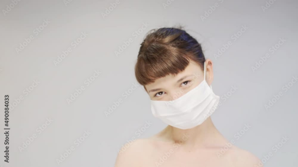 Portrait of a cute girl wearing medical face mask and dancing. Portrait of a cute girl wearing medical face mask and dancing.