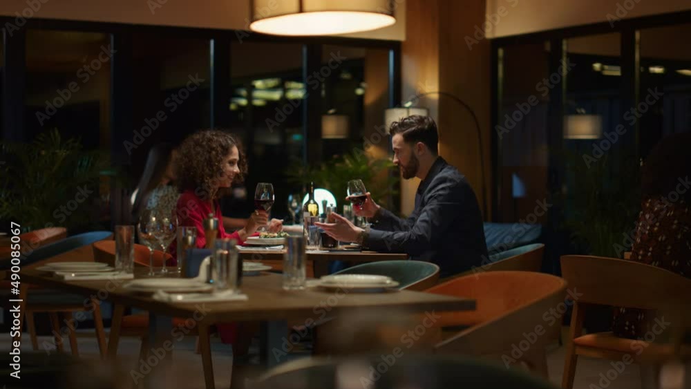 Happy couple drinking wine glass in fancy restaurant table. Romantic concept. Happy couple drinking wine glass in fancy restaurant table. Romantic concept.