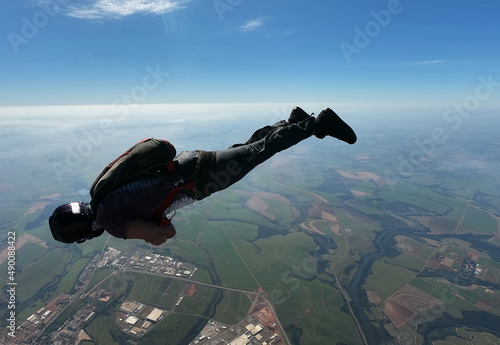 Parachutist performing a maneuver in a stretched body in free fall.