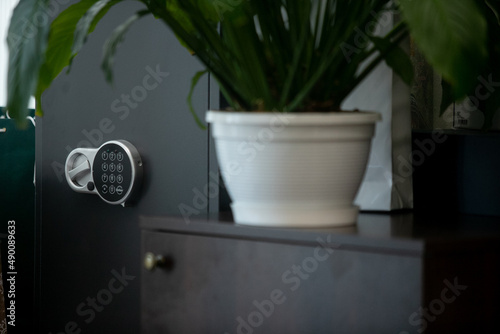 Small modern safe on shelf photo