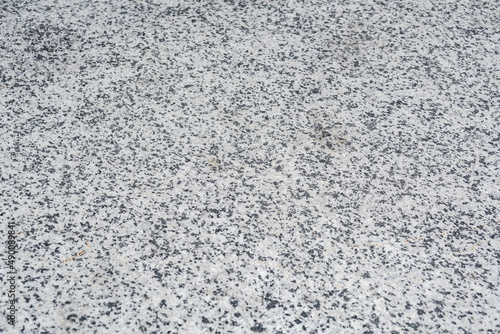 Close-up, texture, background of gray granite wall.