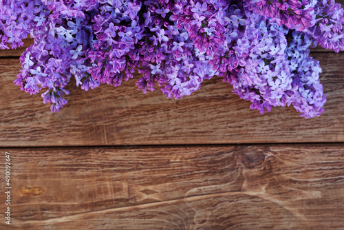lac flowers in bloom on wooden table. Spring concept. Copy space. Top view. Spring concept
