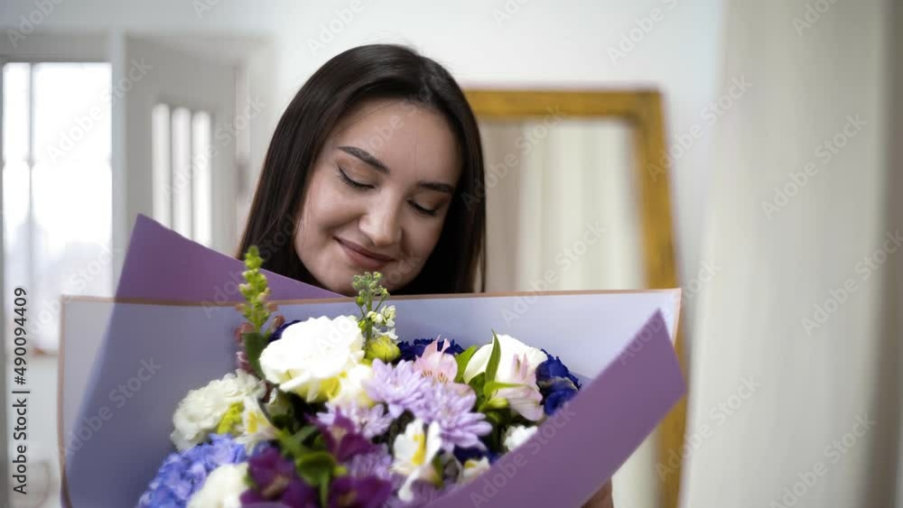 Close-up of a girl giving a bouquet of beautiful flowers. Flowers Close-up of a girl giving a bouquet of beautiful flowers. Flowers
