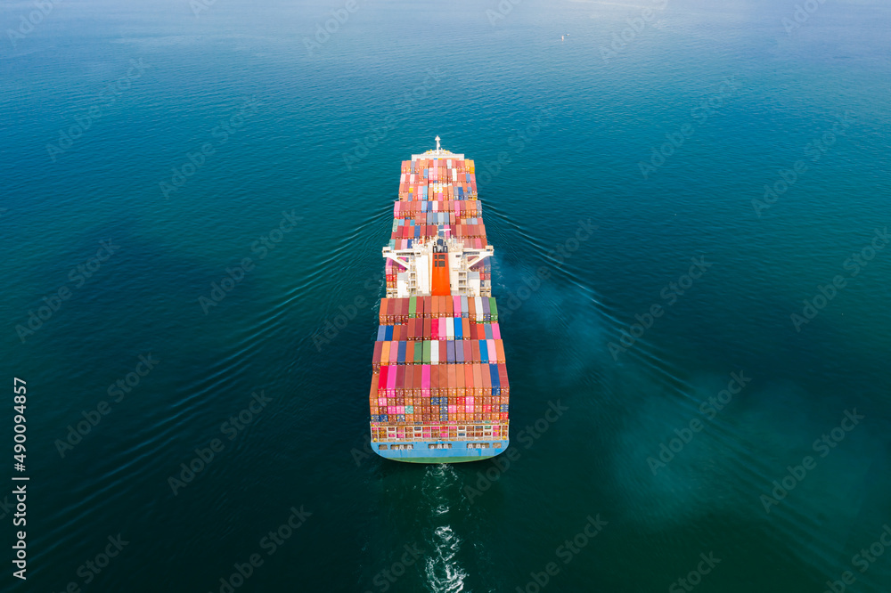 Aerial top view of cargo ship carrying container for import export goods  to customer,concept logistic and supply chain