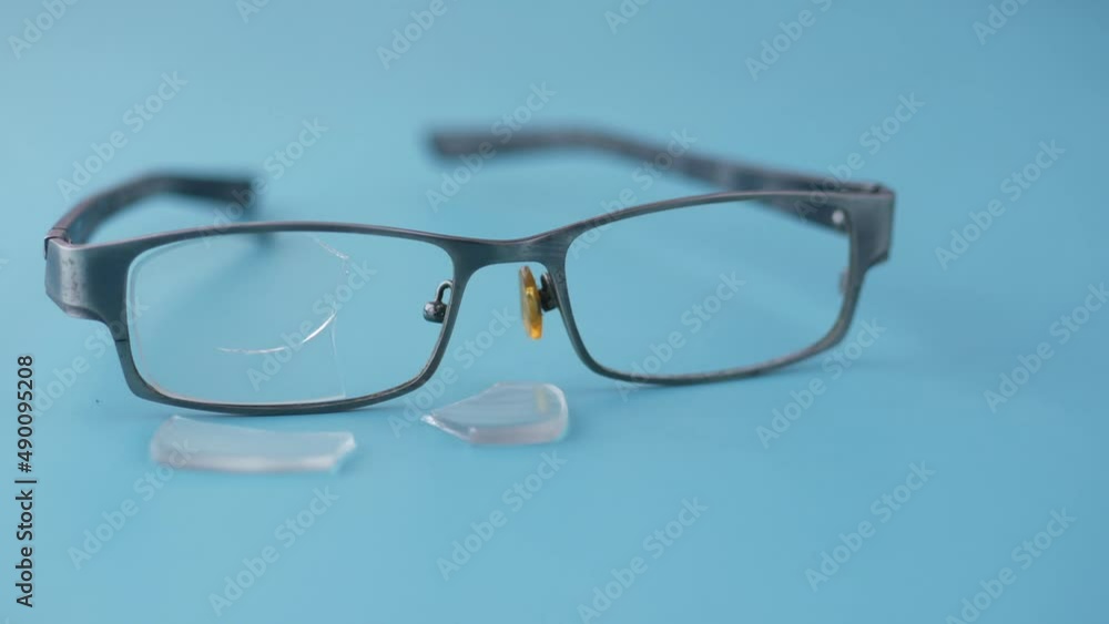 broken eye glass on table with copy space broken eye glass on table with copy space