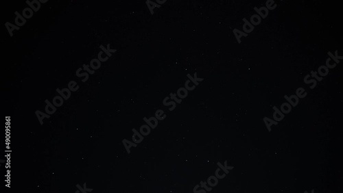 4K Timelapse of dark night sky with stars and moonrise with flare photo