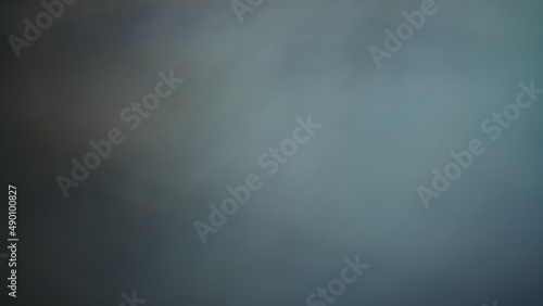 Abstract blur background with brown gray, black, white and earth tones.