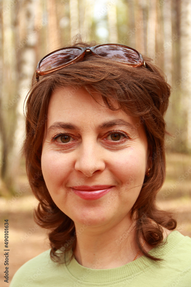 Portrait of a middle-aged woman for a walk in the woods. Portrait of a middle-aged woman for a walk in the woods.