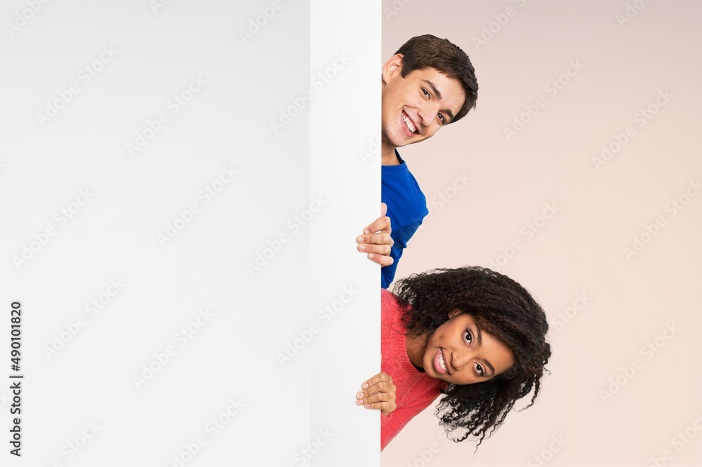 Check This. Smiling Lady Pointing Aside At Copy Space On Blank White Advertisement Board Check This. Smiling Lady Pointing Aside At Copy Space On Blank White Advertisement Board