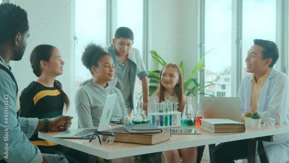 group of students studying and playing with teacher, education and learning concept. group of students studying and playing with teacher, education and learning concept.